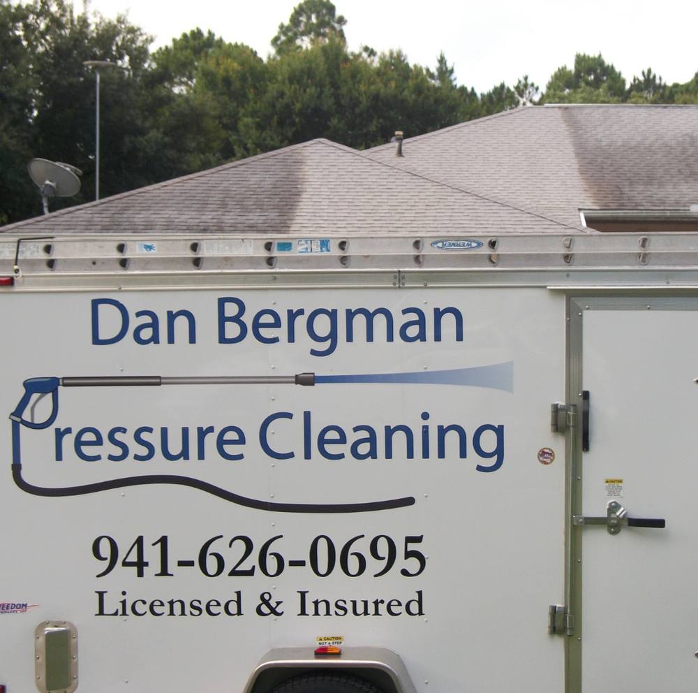 The company trailer lettered Dan Bergman Pressure Cleaning, 941-626-0695, Licensed and Insured